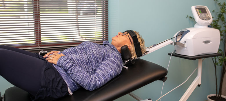 Dr. Bomberg adjusting a mans lower back