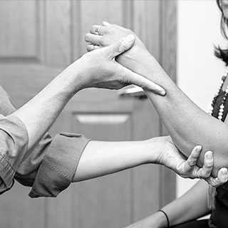 Close up shot of Dr. Bomberg evaluating a patient.