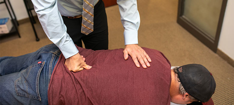 Two men in hard hats talking.